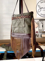 Load and play video in Gallery viewer, Video of Rhonda&#39;s Custom Archive Mini in Moss Ostrich with Dark Roast cowskin leather accents, Leopard print cowskin top stripe accent, antique brass hardware, and lots of Dark Roast leather fringe on the sides and bottom
