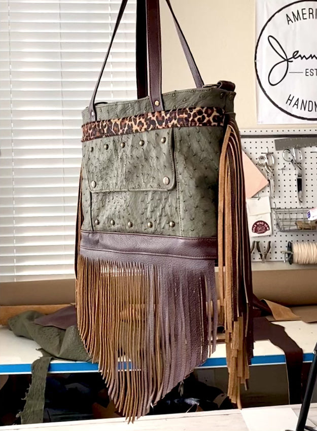 Video of Rhonda's Custom Archive Mini in Moss Ostrich with Dark Roast cowskin leather accents, Leopard print cowskin top stripe accent, antique brass hardware, and lots of Dark Roast leather fringe on the sides and bottom