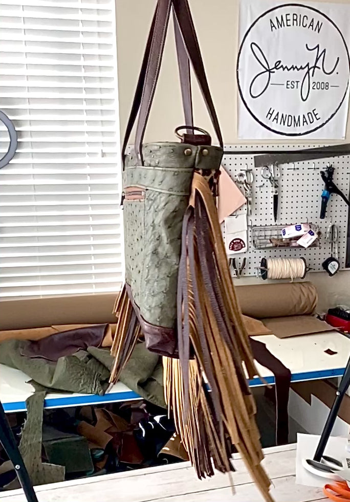 Video of Rhonda's Custom Archive Mini in Moss Ostrich with Dark Roast cowskin leather accents, Leopard print cowskin top stripe accent, antique brass hardware, and lots of Dark Roast leather fringe on the sides and bottom