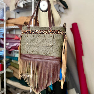 Rhonda's Custom Archive Mini in Moss Ostrich with Dark Roast cowskin leather accents, Leopard print cowskin top stripe accent, antique brass hardware, and lots of Dark Roast leather fringe on the sides and bottom