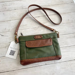 Load image into Gallery viewer, Stella&#39;s Custom Crossbody Clutch in Olive Green Leather with Chestnut Leather Accents, antique brass hardware, and monogram.
