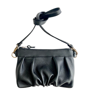 Ruche Clutch in Onyx black fullgrain cowskin leather with pleated detail, and crossbody strap