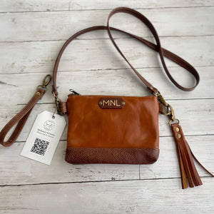 Melissa's Custom Wristlet in Cognac leather with Chestnut leather Accents, antique brass hardware, monogram, and Cognac leather tassel.